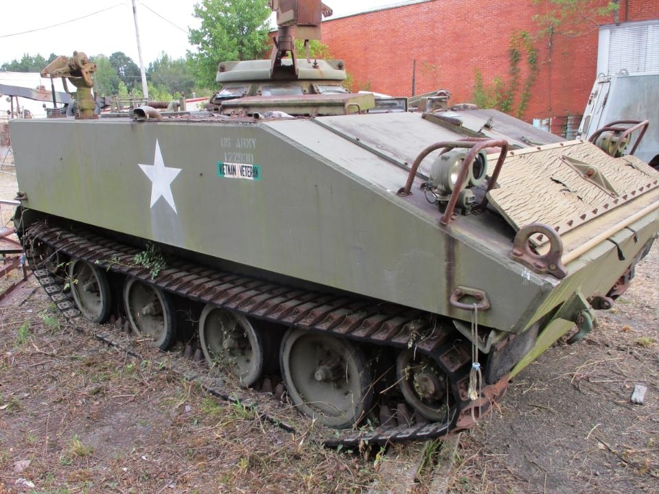 Auction of Military Surplus Includes a Halftrack, M20, 6 Willys Jeeps