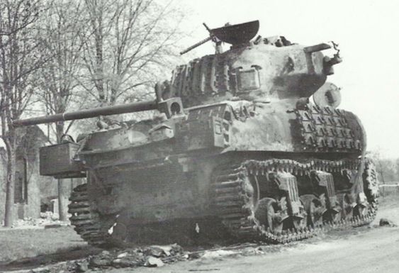 Burned out Commonwealth Sherman IIB (M4A1 76W); note the rubber burned off of the tracks