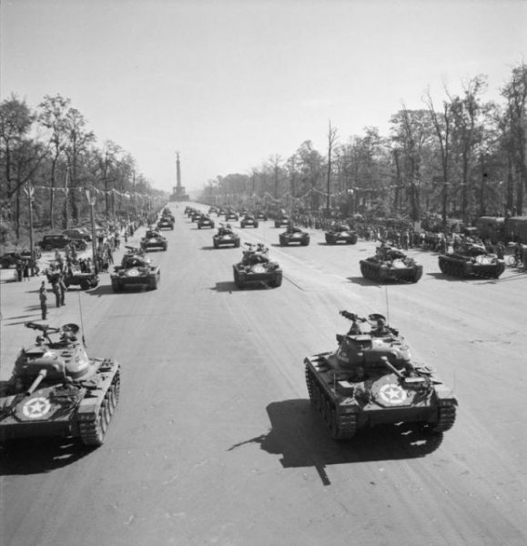 Germany Under Allied Occupation American Light Tanks drive down the Charlottenburg Chaussee in Berlin during the Four Nations VJ Day parade.