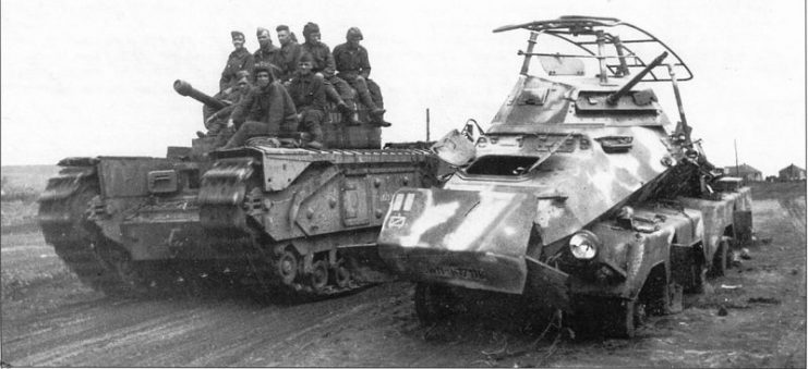 A Soviet Churchill Mk IV passes a knocked-out German Sd.Kfz 232 (8-Rad) armoured car at the fourth battle of Kharkov in 1943