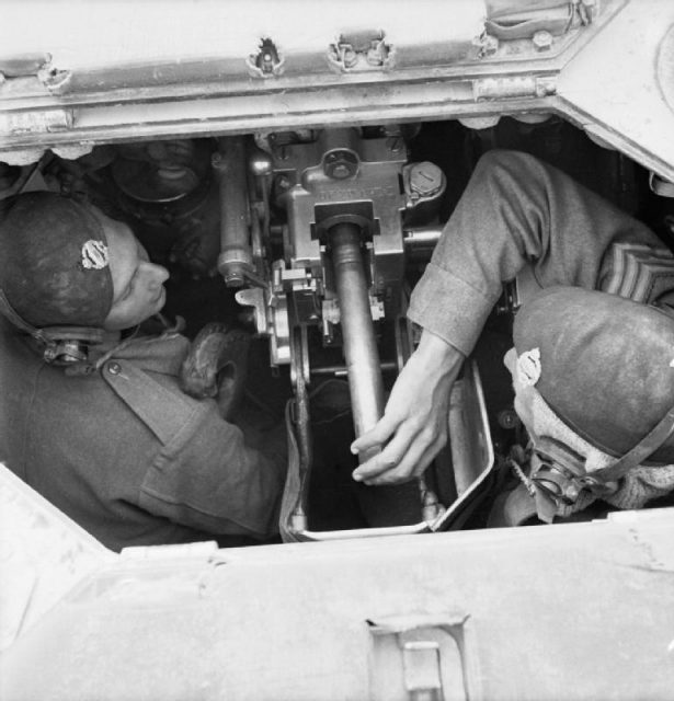 Crew inside a Valentine tank loading the 2-pounder gun