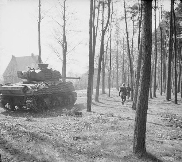 Firefly of 5th Canadian Armoured Division assists troops of 49th (West Riding) Division to clear the Germans from Ede, Netherlands, 17 April 1945