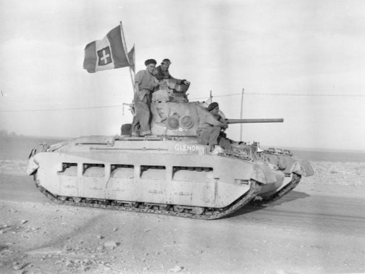 Matilda II.A Matilda’s crew display a captured Italian flag as they enter Tobruk, January 1941
