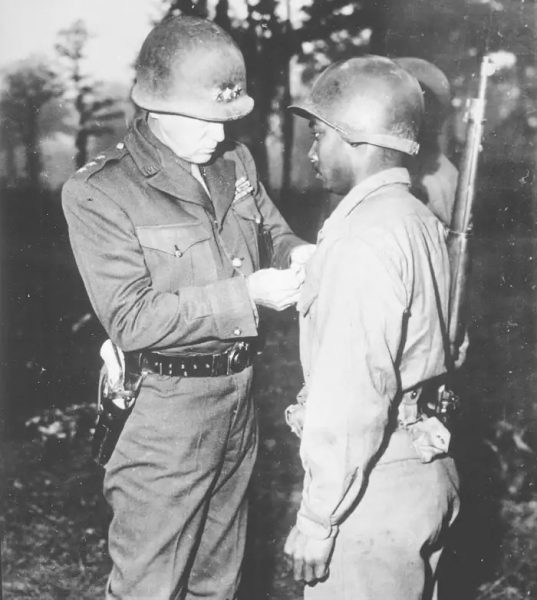 General George S. Patton pinning the Silver Star on Private Ernest A. Jenkins of the 761st Tank Battalion for his conspicuous gallantry in the liberation of Chateaudun, France, 1944. Courtesy of the U.S. National Archives