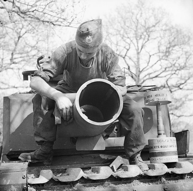 AVRE 290mm Petard Mortar and its ammunition (projectile standing on its flat nose, with tail facing up, at right)